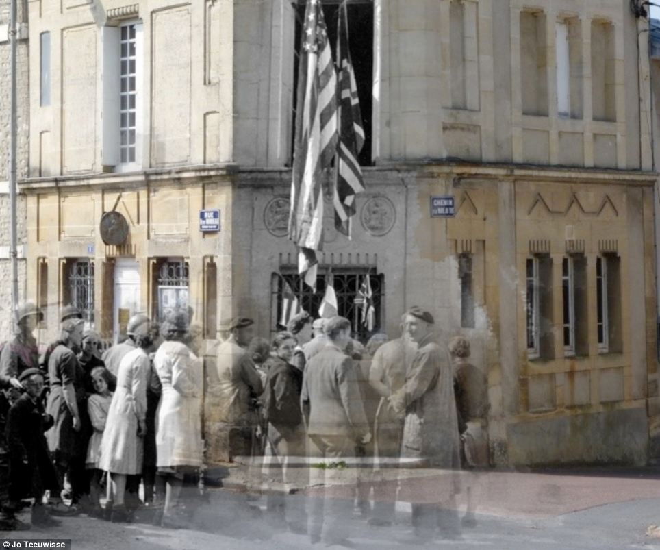 New world: An American flag speaks of Allied progress in this engrossing image from the streets of France