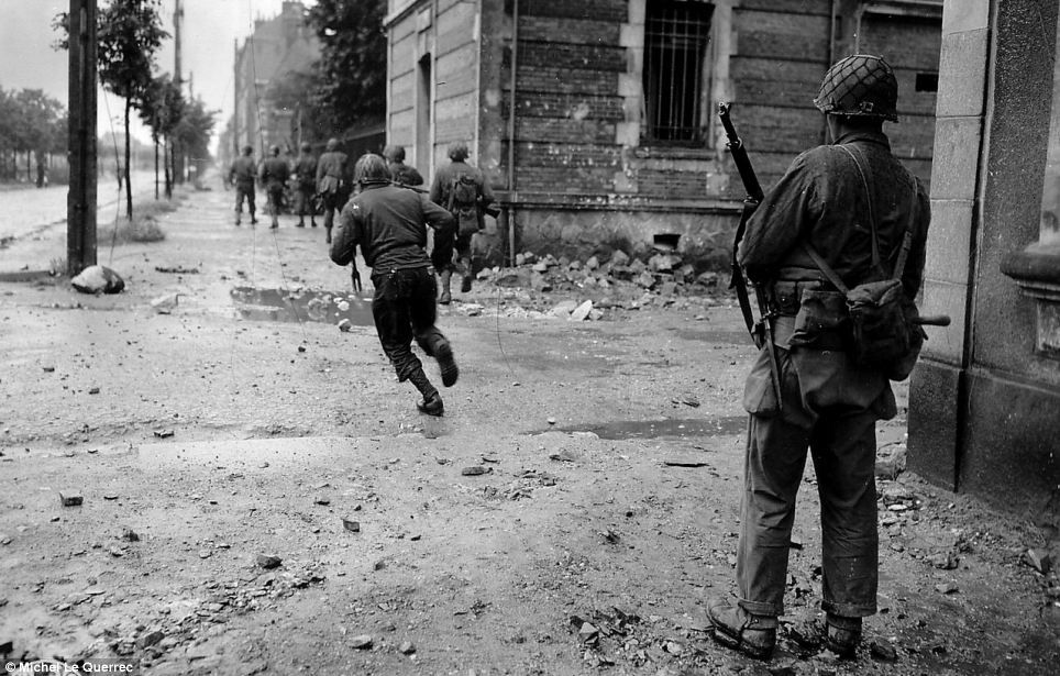 Fear and fighting: The original image from 1944, before it was laid over a photo taken from the exact same spot today