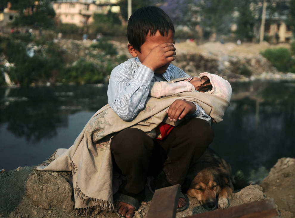 A boy in Nepal being evicted from his home