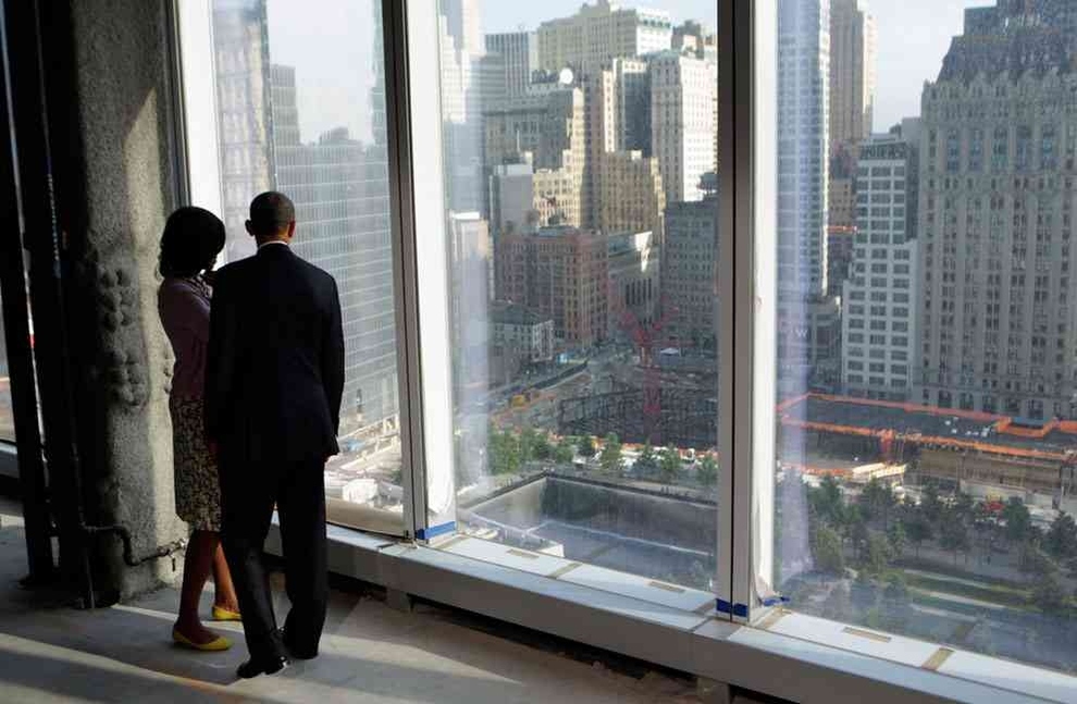 The president and First Lady looking down onto the 9/11 memorial