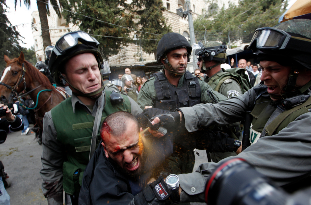 A man being pepper-sprayed directly in the face